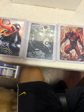 3 cards from the Peru set.1 venom lenticular and 1 acetate and 1 carnage acetate picture