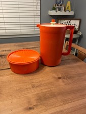 Vtg tupperware orange pitcher and push top round canister picture