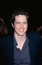 Actor Hugh Grant arrives at the premiere of Notting Hill held at t- Old Photo picture