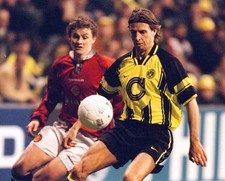 Ole Gunnar Solskjaer of Manchester United pursues Borussia Dortmun- Old Photo picture