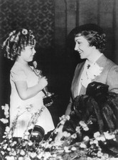 The American Actress Claudette Colbert congratulating Shirley Temp- 1935 Photo picture
