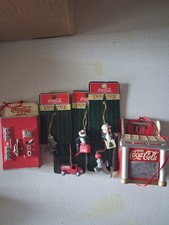 A collection of Coca-Cola themed Christmas ornaments Set Of 7 picture