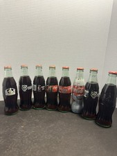 8 Vintage Coca-Cola Full Unopened Bottles Blazers NASCAR Holiday Collectible picture