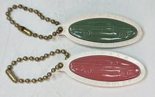2 Vintage 1950s Chevrolet Impala Hard Rubber Advertisement Key Chains Red Green picture