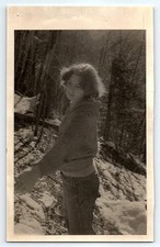 Black & White Photograph 1980's Woman in Woods on Snowy Hill picture