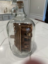 Detailed Handmade Wooden Log Cabin in Vintage One Gallon Glass Jug - Folk Art picture
