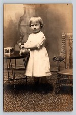 RPPC Little Girl Plays Glaring w/ Toy Image ANTIQUE Postcard ARTURA 1910-24 picture