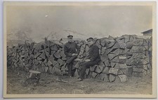 ​Antique RPPC Men in Uniform Peaked Caps Firewood Stack Mountain Views 1907-1914 picture