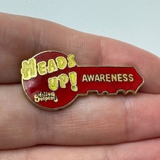 Millers Outpost Heads Up Awareness Key Shaped Employee Lapel Pin Clothing Store picture