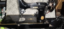 The Singer Featherweight 221 Vintage 1951 Sewing Machine with Case is a classic picture
