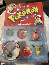 Pokémon Grabber Ball With Two Pokémon And Pokémon Badge picture