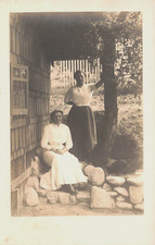 TWO WOMAN OUTSIDE ON ROCKS BY HOUSE PORTRAIT REAL PHOTO POSTCARD 1910s RPPC picture